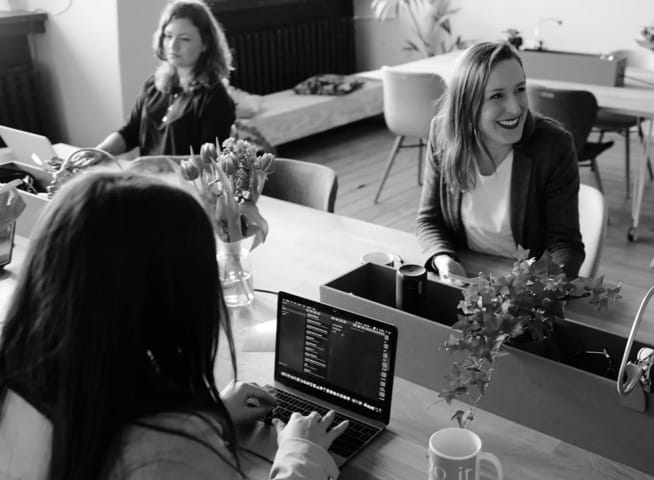 people happily working in the office